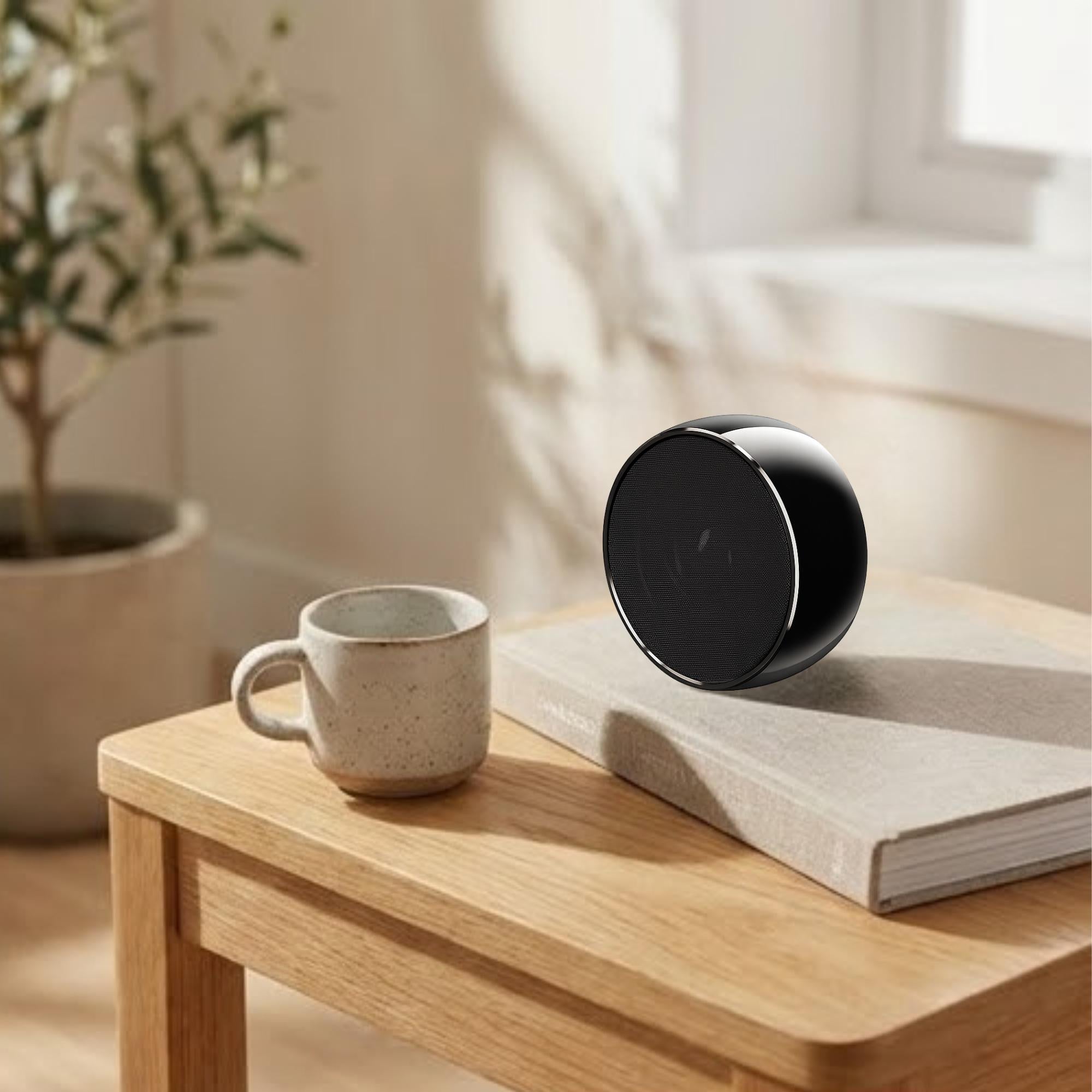 Titanium Bluetooth speaker on office desk modern corporate audio accessory with hands-free calling and wireless connectivity